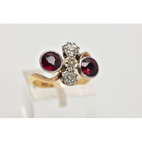 256 - AN EARLY 20TH CENTURY 18CT GOLD GARNET AND DIAMOND DRESS RING, of a cross over design, the centre pi... 