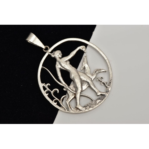 264 - A SILVER OPENWORK PENDANT, depicting goddess Diana bearing a bow walking with a deer, engraved to th... 