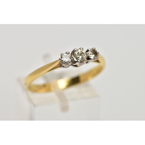 265 - AN 18CT GOLD THREE STONE DIAMOND RING, designed with a row of three graduated round brilliant cut di... 