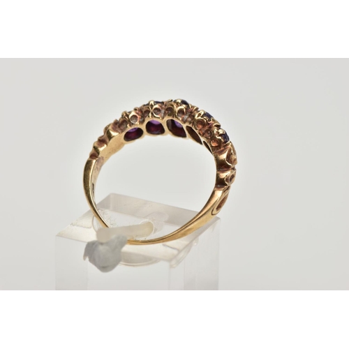 270 - A 9CT GOLD FIVE STONE AMETYHST RING, designed with a row of five graduated oval cut amethyst, scroll... 