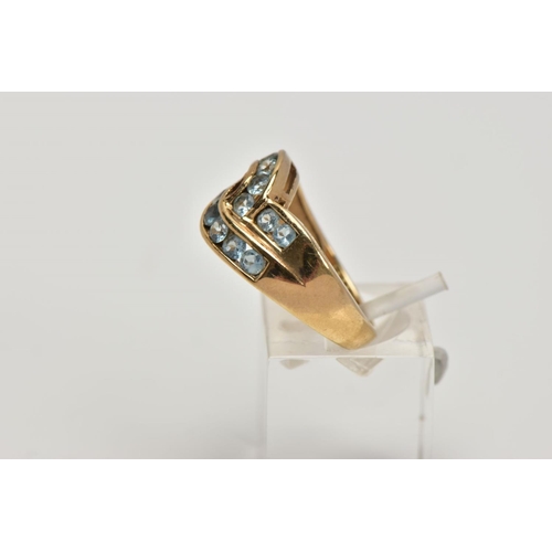 276 - A 9CT GOLD AQUAMARINE DRESS RING, of a crossover design, set with two rows of channel set circular c... 