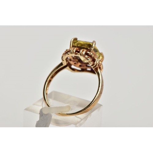 278 - A 9CT GOLD DRESS RING, designed with a claw set rectangular cut stone assessed as citrine, rope twis... 