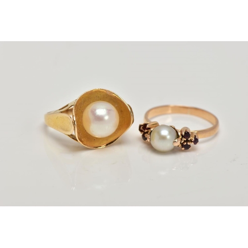 279 - TWO YELLOW METAL CULTURED PEARL RINGS, the first set with a single cultured pearl, flanked with circ... 