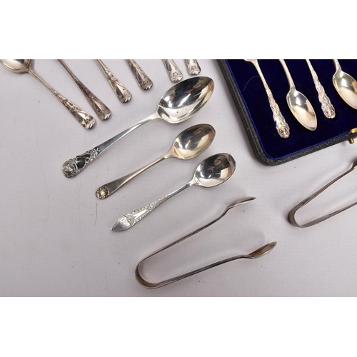 293 - A SELECTION OF SILVER TEASPOONS AND SUGAR TONGS, to include a cased set of six teaspoons, each decor... 