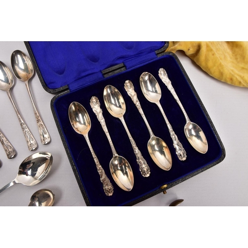 293 - A SELECTION OF SILVER TEASPOONS AND SUGAR TONGS, to include a cased set of six teaspoons, each decor... 