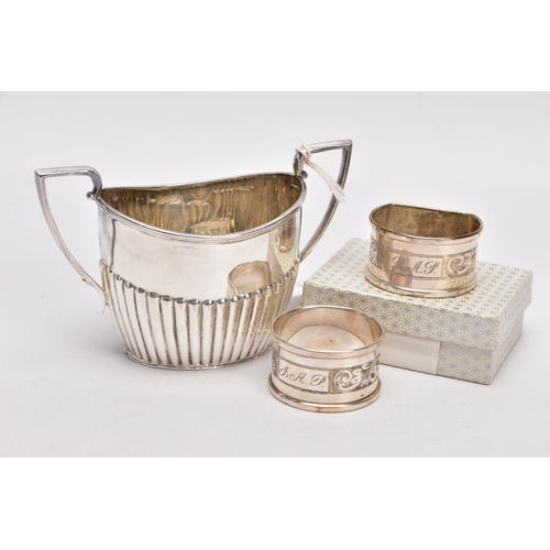 315 - A SILVER SUGAR BOWL AND TWO NAPKINS, the sugar bowl of an oval form, stop reeding design to the body... 