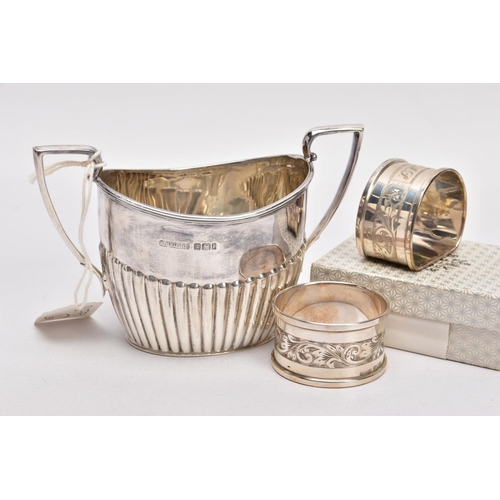 315 - A SILVER SUGAR BOWL AND TWO NAPKINS, the sugar bowl of an oval form, stop reeding design to the body... 