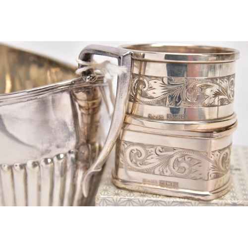 315 - A SILVER SUGAR BOWL AND TWO NAPKINS, the sugar bowl of an oval form, stop reeding design to the body... 