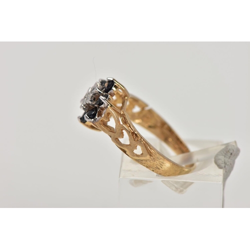 342 - A 9CT GOLD SAPPHIRE AND DIAMOND CLUSTER RING, the raised cluster of a flower shape, set with a centr... 