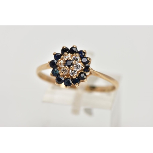 343 - A 9CT GOLD SAPPHIRE AND CUBIC ZIRCONIA CLUSTER RING, raised cluster set with a central circular cut ... 