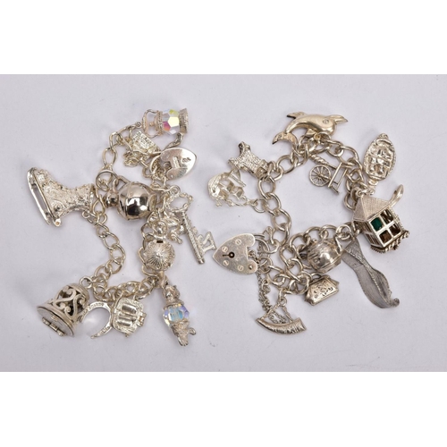 350 - TWO SILVER CHARM BRACELETS, the first fitted with eleven charms in forms such as a key, teapot, crys... 