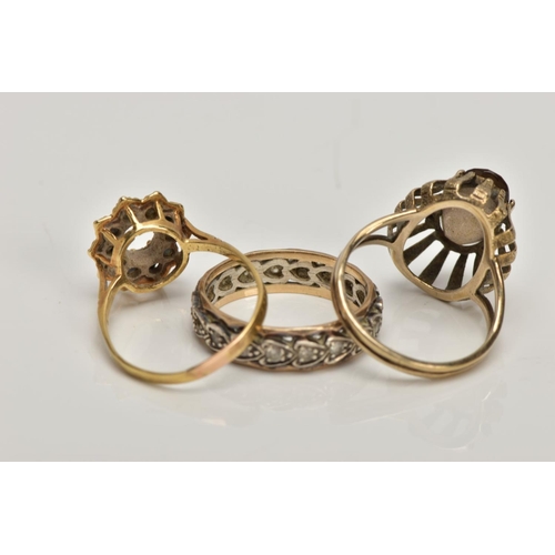 357 - A 9CT GOLD DRESS RING AND TWO YELLOW METAL RINGS, the first of an oval shape set with an oval cut sm... 