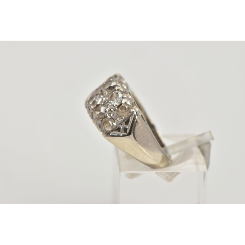 360 - A WHITE METAL DIAMOND RING, designed with two rows of claw set, graduated old and round brilliant cu... 