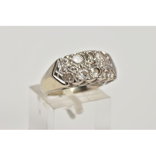 360 - A WHITE METAL DIAMOND RING, designed with two rows of claw set, graduated old and round brilliant cu... 