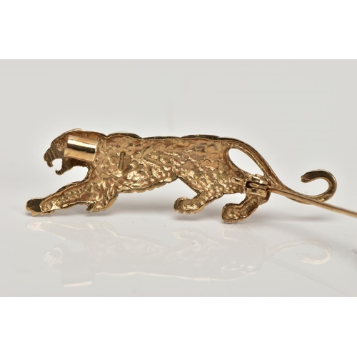 362 - A 9CT GOLD BROOCH, in the form of a realistically stylised tiger, set with a circular cut ruby eye, ... 