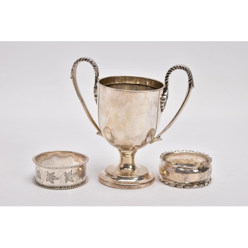 366 - A MINIATURE SILVER TROPHY CUP AND TWO SILVER NAPKIN RING, plain polished body raised on a circular s... 