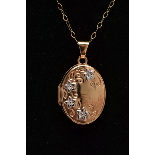 368 - A 9CT GOLD LOCKET PENDANT NECKLACE, the locket of an oval form, decorated with white metal flowers, ... 