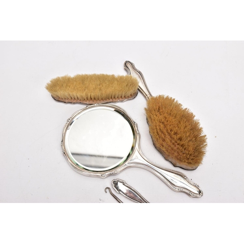 379 - A THREE-PIECE SILVER VANITY SET A BUTTON HOOK AND A SHOEHORN, the vanity set comprising of a hairbru... 