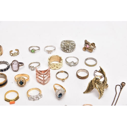 380 - A BAG OF MOSTLY COSTUME RINGS, yellow and white metal rings in various styles, some fitted with past... 