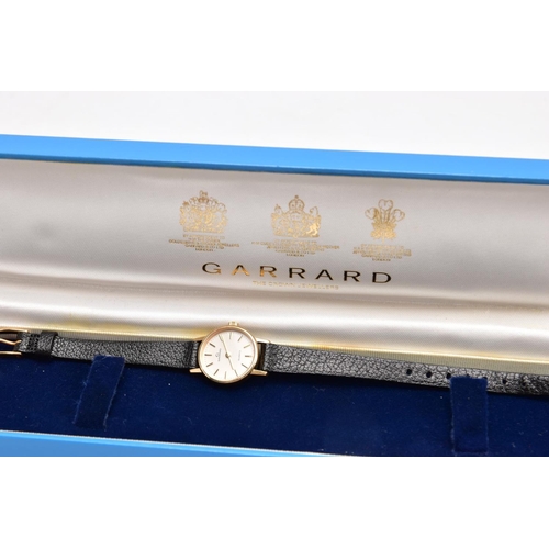 381 - A LADIES 9CT GOLD 'GARRARD' WRISTWATCH, quartz movement, round champagne dial signed 'Garrard', bato... 