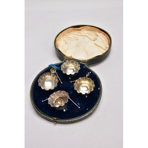 384 - A CASED SET OF FOUR SILVER SALTS WITH SALT SPOONS, each salt of a round shape, scallop rims, raised ... 