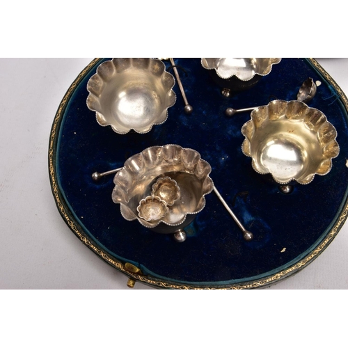 384 - A CASED SET OF FOUR SILVER SALTS WITH SALT SPOONS, each salt of a round shape, scallop rims, raised ... 