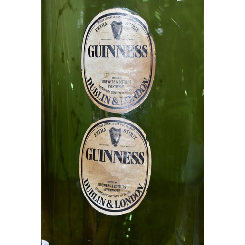 429 - A LARGE GLASS GUINNESS ADVERTISING BOTTLE, with labels 'Extra Stout  Guinness, Dublin & London', hei... 