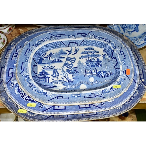 434 - FIFTEEN PIECES OF BLUE AND WHITE CERAMICS, mostly late Victorian, comprising eight meat plates, main... 