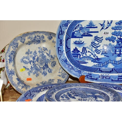 434 - FIFTEEN PIECES OF BLUE AND WHITE CERAMICS, mostly late Victorian, comprising eight meat plates, main... 