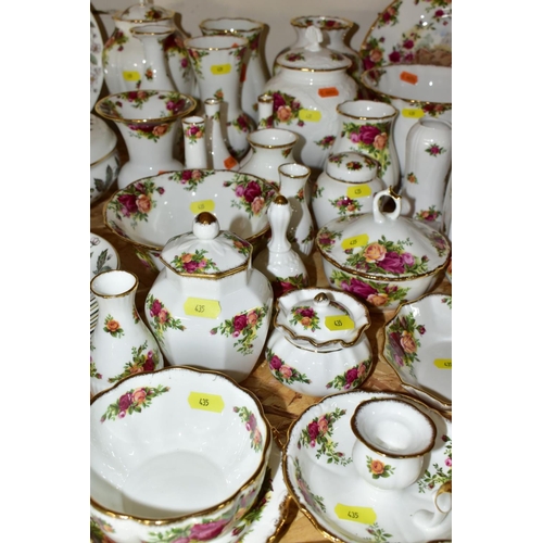 435 - APPROXIMATELY FIFTY PIECES OF ROYAL ALBERT OLD COUNTRY ROSES GIFTWARE, to include vases, (tallest 19... 