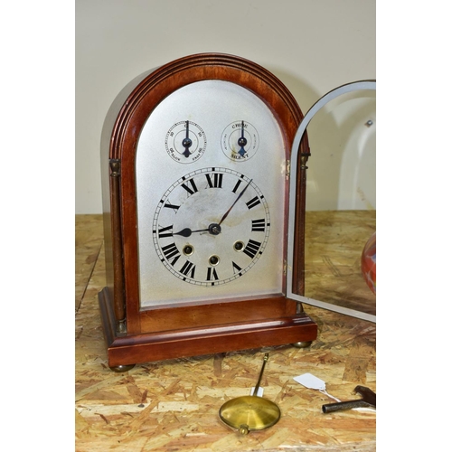 446 - AN EARLY 20TH CENTURY MAHOGANY CASED DOME TOP MANTEL CLOCK, silver coloured arched dial with slow/fa... 