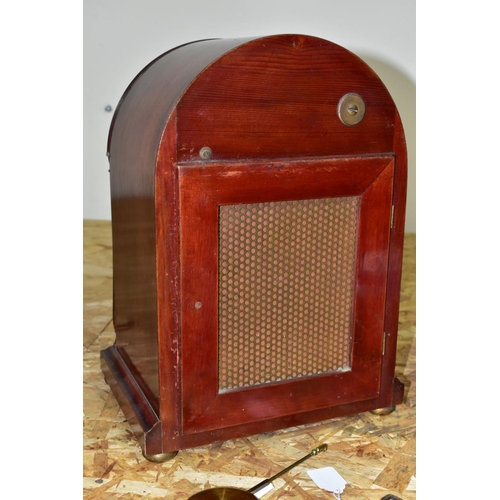 446 - AN EARLY 20TH CENTURY MAHOGANY CASED DOME TOP MANTEL CLOCK, silver coloured arched dial with slow/fa... 