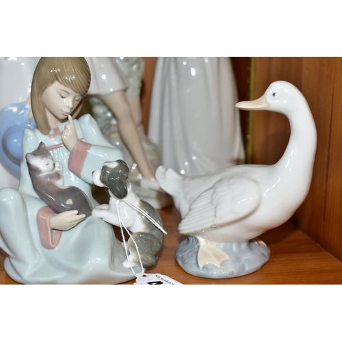 461 - A LLADRO AND FOUR NAO FIGURINES, the Lladro 5640 'Cat Nap', designed by Juan Huerta, issued 1990, he... 