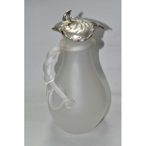 463 - A FROSTED GLASS WATER JUG OF BALUSTER FORM, with vine leaf shaped white metal hinged cover, indistin... 