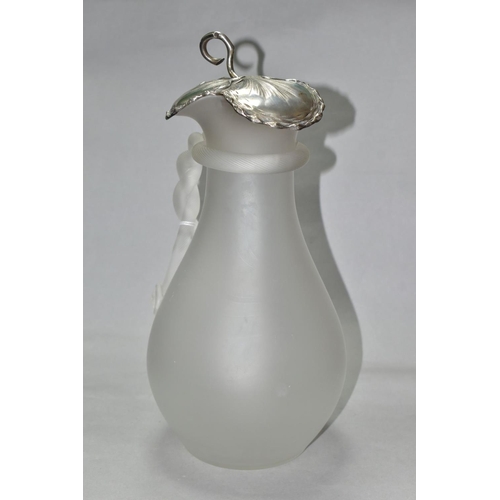 463 - A FROSTED GLASS WATER JUG OF BALUSTER FORM, with vine leaf shaped white metal hinged cover, indistin... 