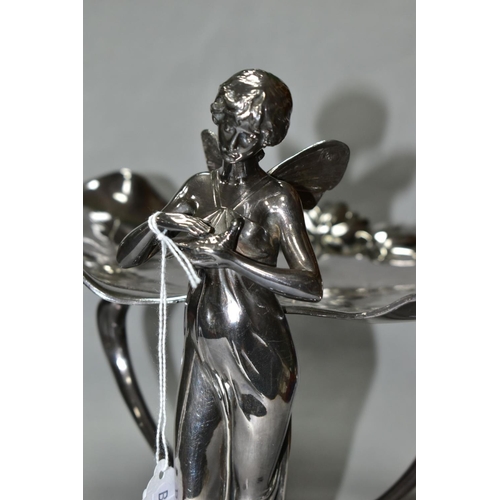 477 - A SILVER PLATED WMF ART NOUVEAU COMPORT, in the form of a fairy holding a bird with two lily pads at... 