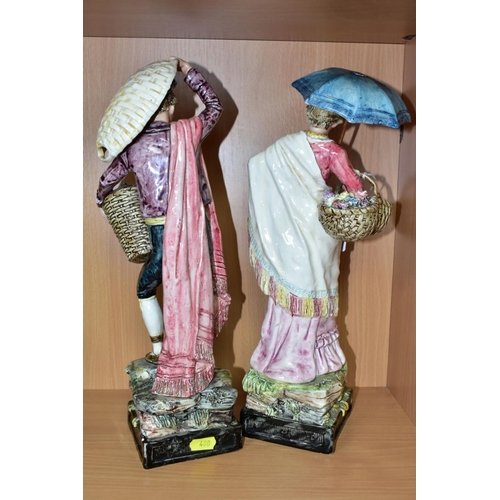 480 - A PAIR OF ROYAL DUX FIGURINES OF CONTINENTAL STREET VENDORS, the gentleman with a basket of fish, hi... 