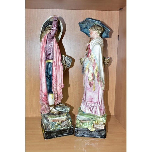 480 - A PAIR OF ROYAL DUX FIGURINES OF CONTINENTAL STREET VENDORS, the gentleman with a basket of fish, hi... 