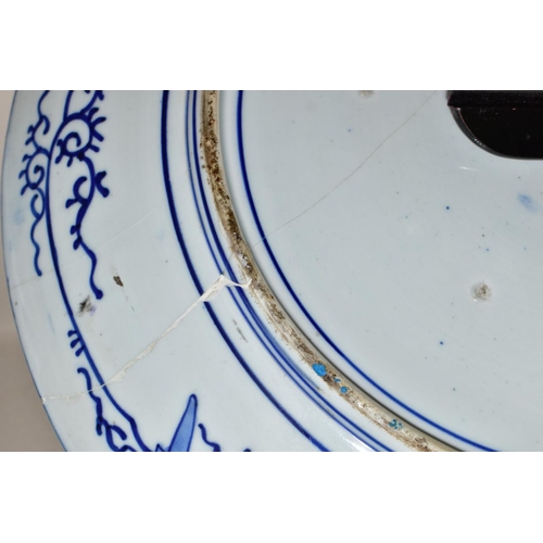 501 - A LATE 19TH CENTURY JAPANESE PORCELAIN CHARGER, blue and white decoration of an exotic bird amongst ... 