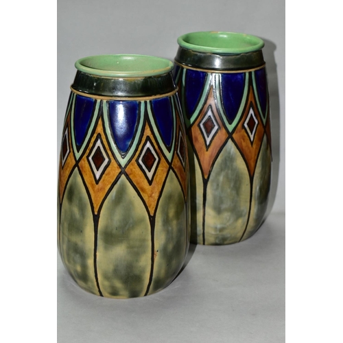 502 - A PAIR OF EARLY 20TH CENTURY ROYAL DOULTON STONEWARE BALUSTER VASES, incised and glazed with geometr... 