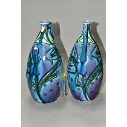 507 - A PAIR OF MINTON LTD SECESSIONIST TWIN HANDLED VASES, tube line decorated with green stylised flower... 