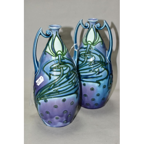 507 - A PAIR OF MINTON LTD SECESSIONIST TWIN HANDLED VASES, tube line decorated with green stylised flower... 