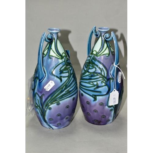 507 - A PAIR OF MINTON LTD SECESSIONIST TWIN HANDLED VASES, tube line decorated with green stylised flower... 