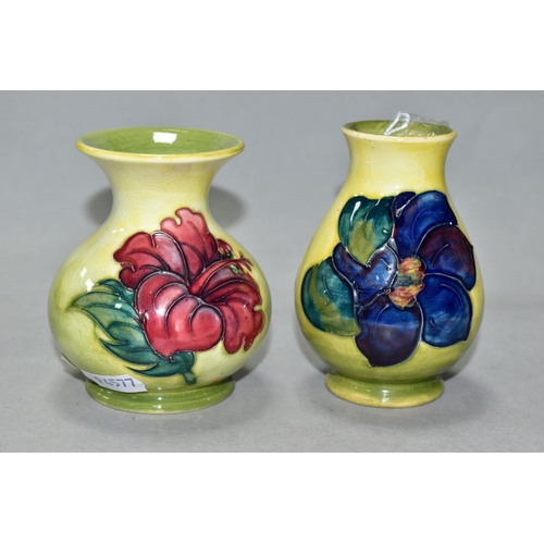 512 - TWO SMALL MOORCROFT POTTERY VASES, comprising a baluster shaped vase in Clematis pattern with purple... 