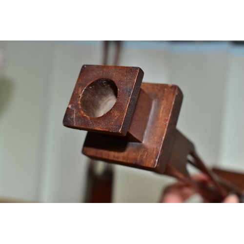 540 - A PAIR OF 20TH CENTURY MAHOGANY AND STAINED CANDLESTICKS, square holder above four slender twisted o... 