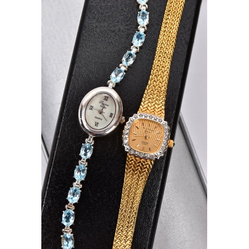 241 - TWO BOXED LADIES WRISTWATCHES, the first a white metal watch with an oval mother of pearl dial signe... 