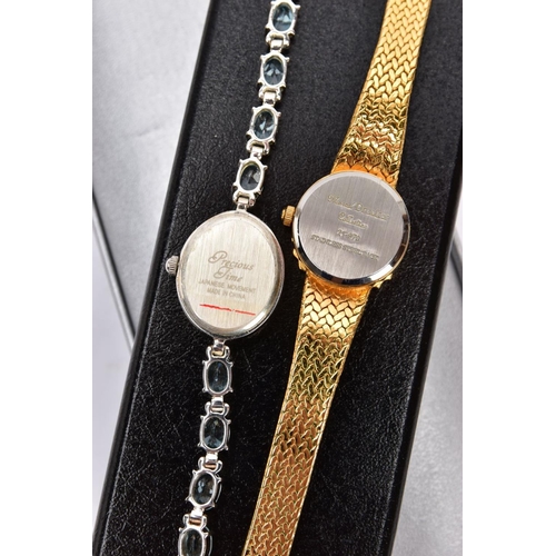 241 - TWO BOXED LADIES WRISTWATCHES, the first a white metal watch with an oval mother of pearl dial signe... 