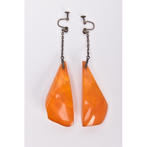 337 - A PAIR OF NATURAL AMBER EARRINGS, the large drop earrings each of a tapered outline suspended from a... 