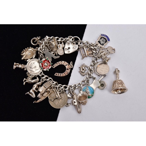 339 - A SILVER CHARM BRACELET AND TWO LOOSE CHARMS, the charm bracelet fitted with twenty-six charms in fo... 