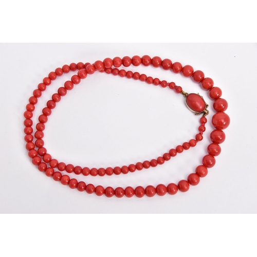 395 - A DYED CORAL BEAD NECKLACE, designed as a row of graduated dyed coral beads measuring approximately ... 